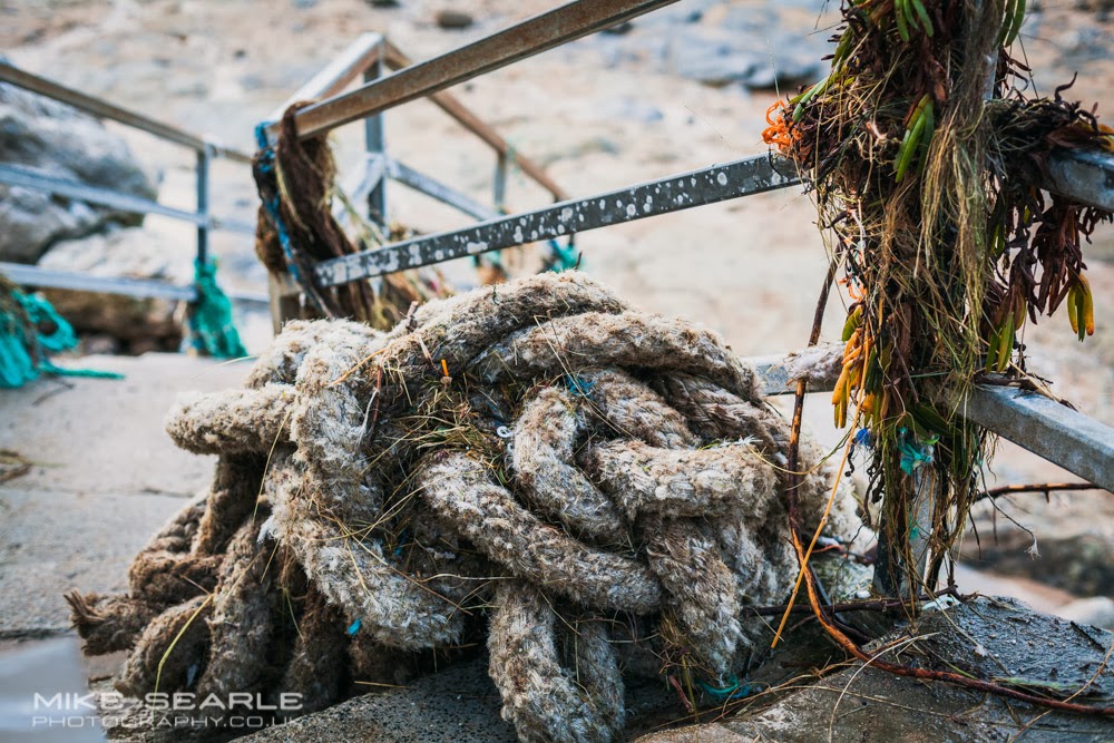 Rope and fishing nets wrapped round a railing at South Fistral